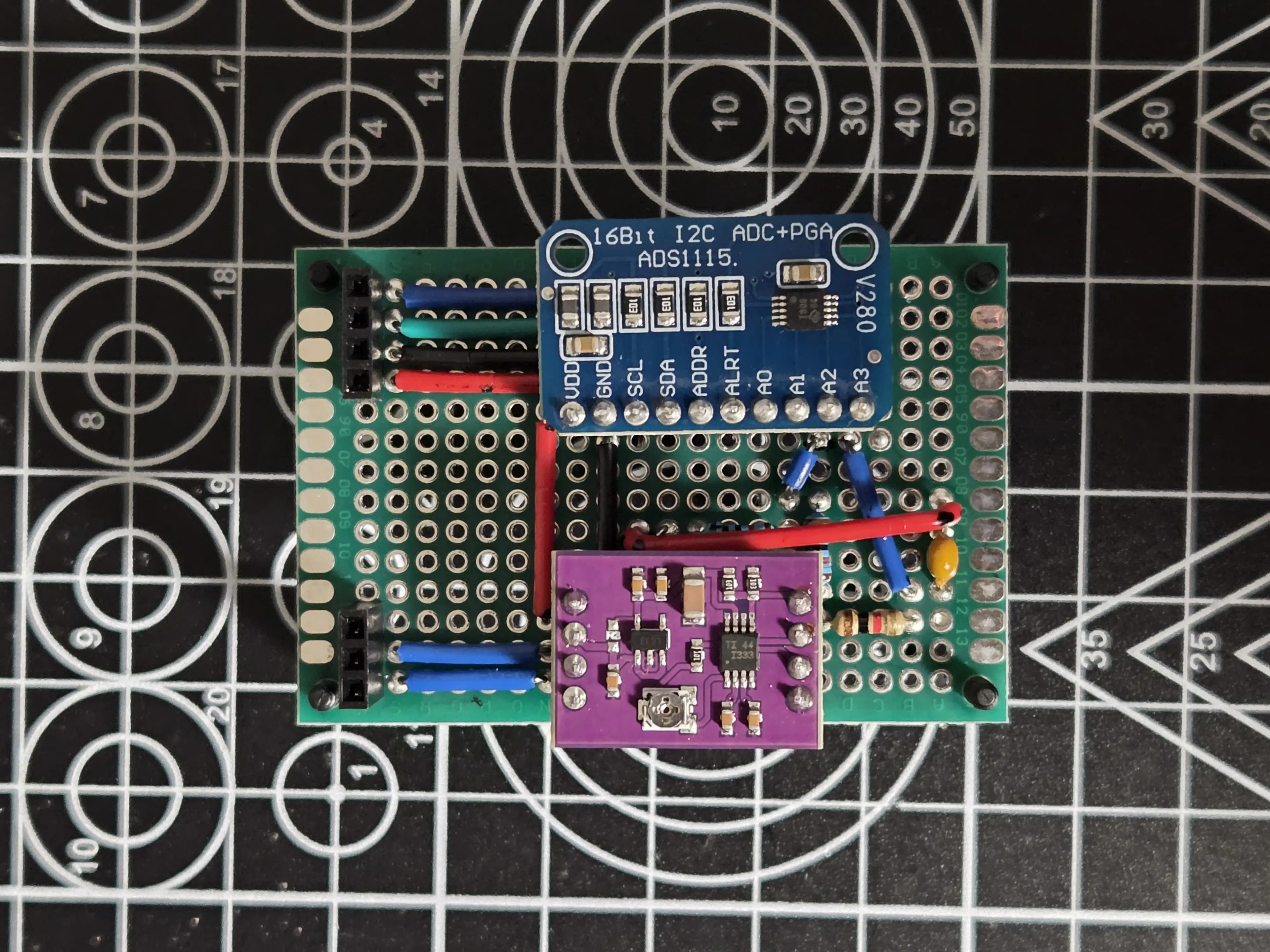 Perfboard with an INA333 and ADS1115 solder on
